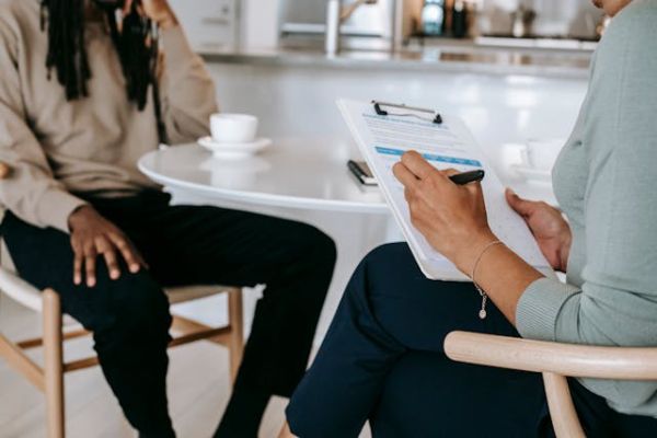 mental health professional conducting a psychological evaluation with a male client