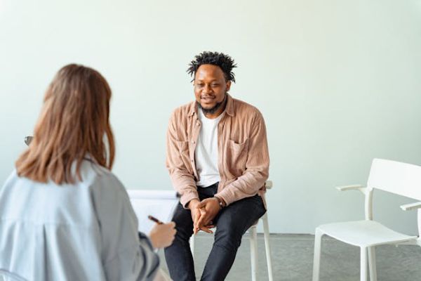 therapist conducting a psychological interview with a male client