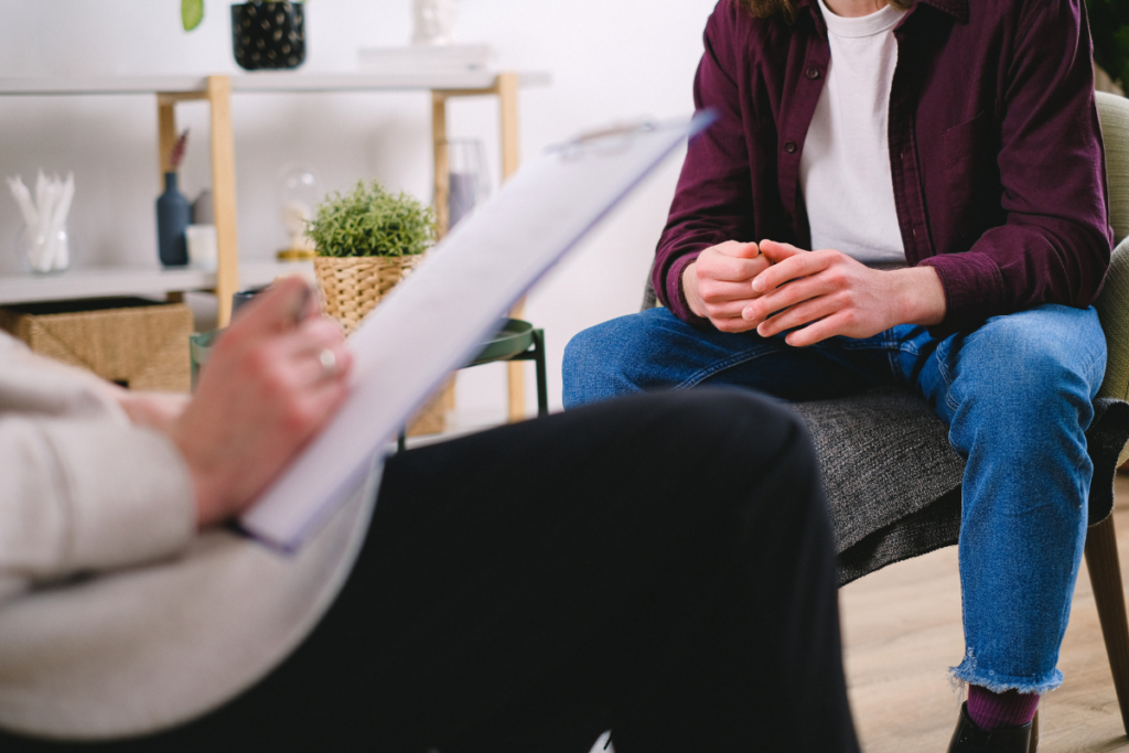 Man in a therapy session with his court-ordered therapist.