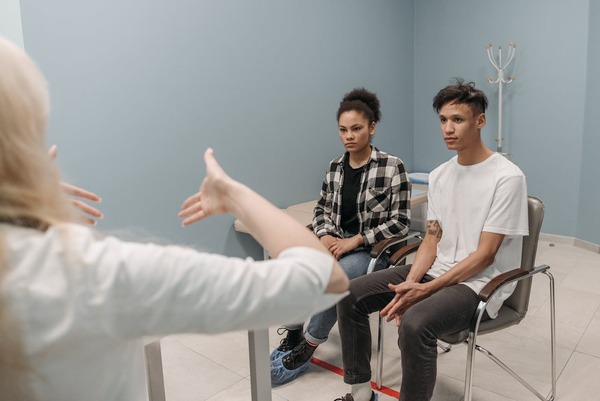 A professional explaining the process of the parenting class