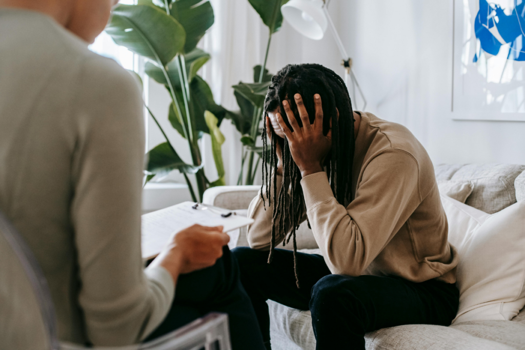 A man talking to his therapist during a session.