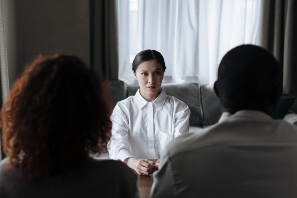 A woman listening to the couple’s stories