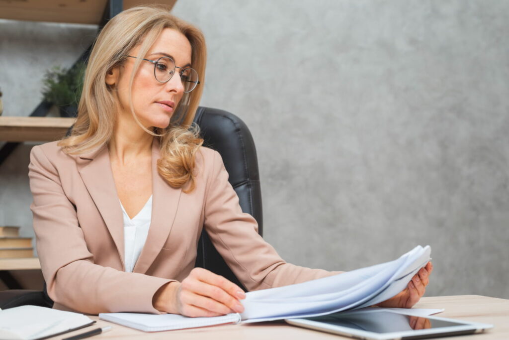 A forensic psychologist reading important documents