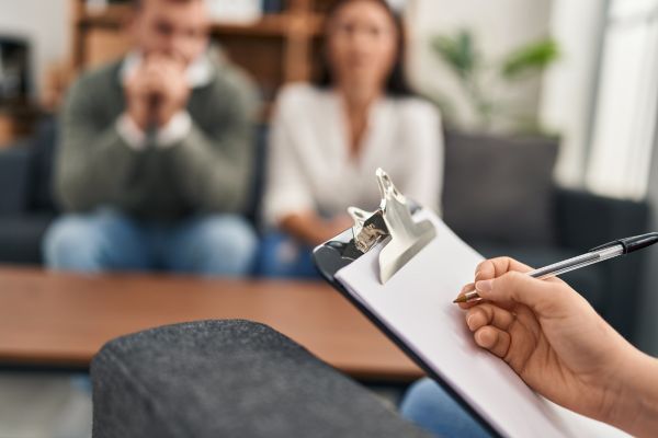 Forensic psychology session with a psychologist evaluating clients.