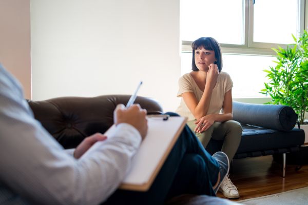 A woman eagerly listening to her psychologist.