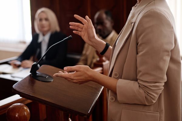 A forensic psychology expert testifying in court during a trial.
