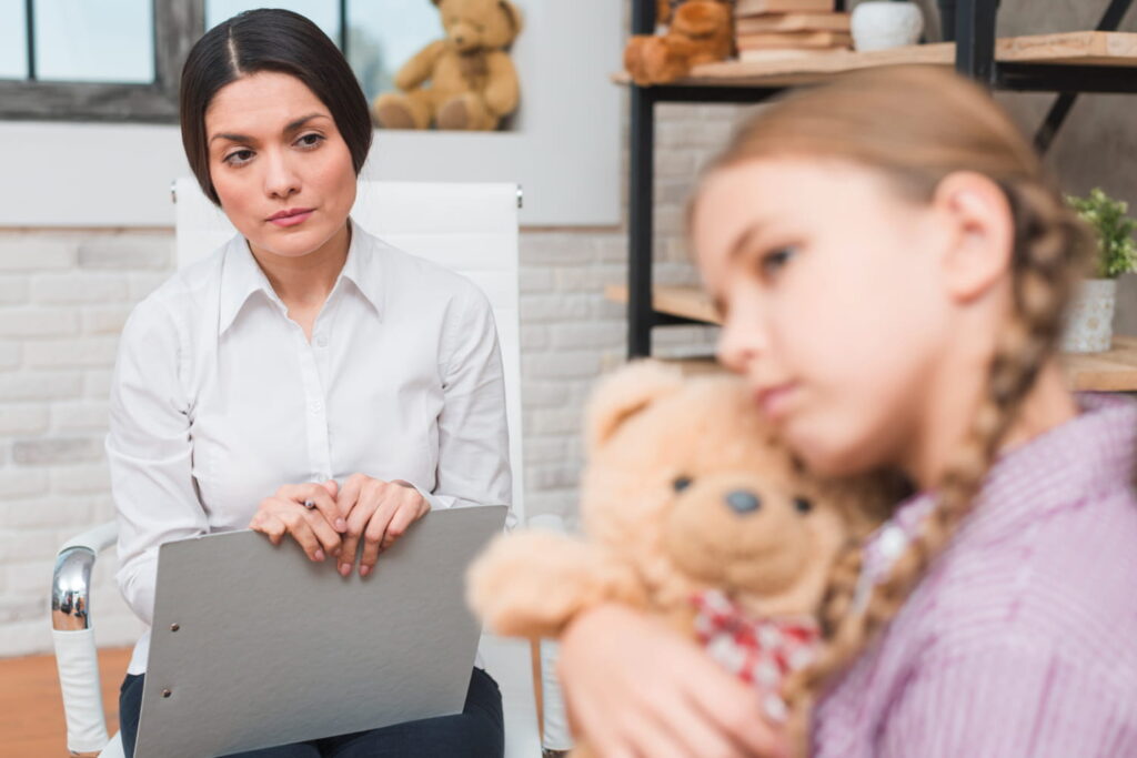A psychologist observing the child’s behavior