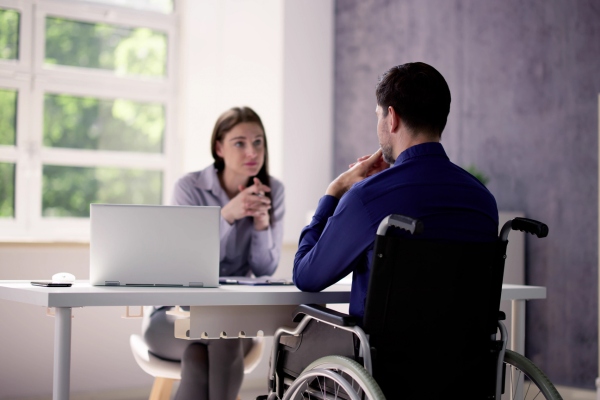 Psychologist conducting a personal injury evaluation with an injured worker.