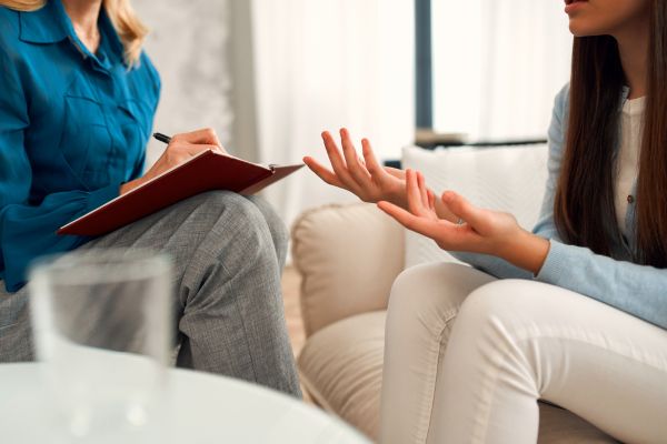 Woman consulting a psychologist in office