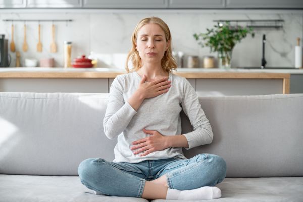 Woman taking deep breath before evaluation