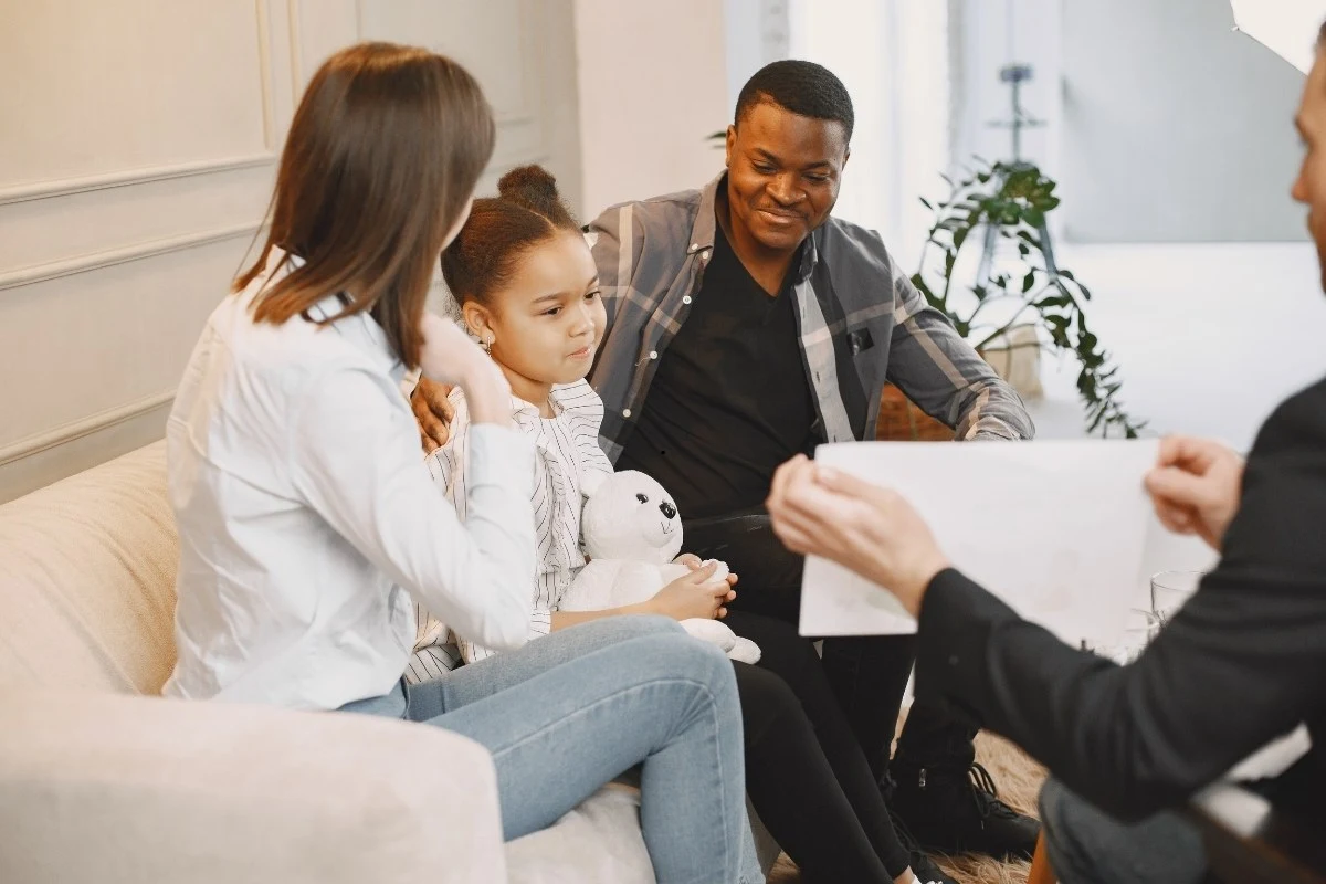 Co-parents attending a family counseling session together.