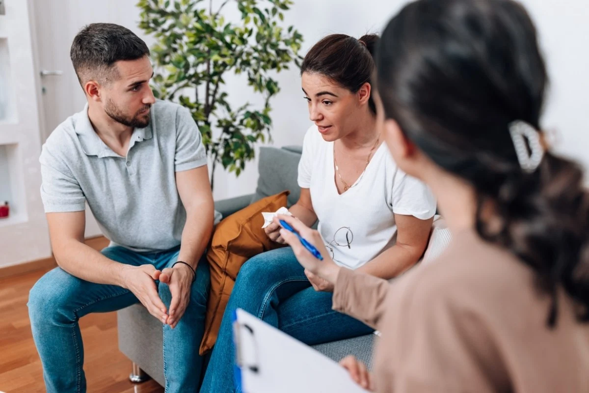 Couple participating in a reunification therapy session.