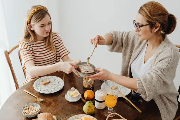 Mother serving nutritious breakfast to child