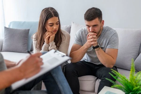 Parents participating in co-parenting counseling