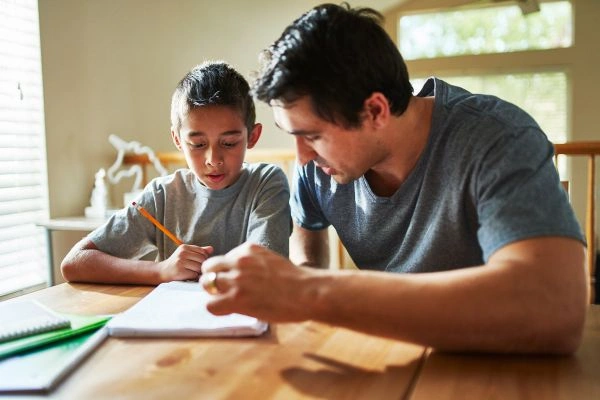 Father teaching child cognitive skills at home