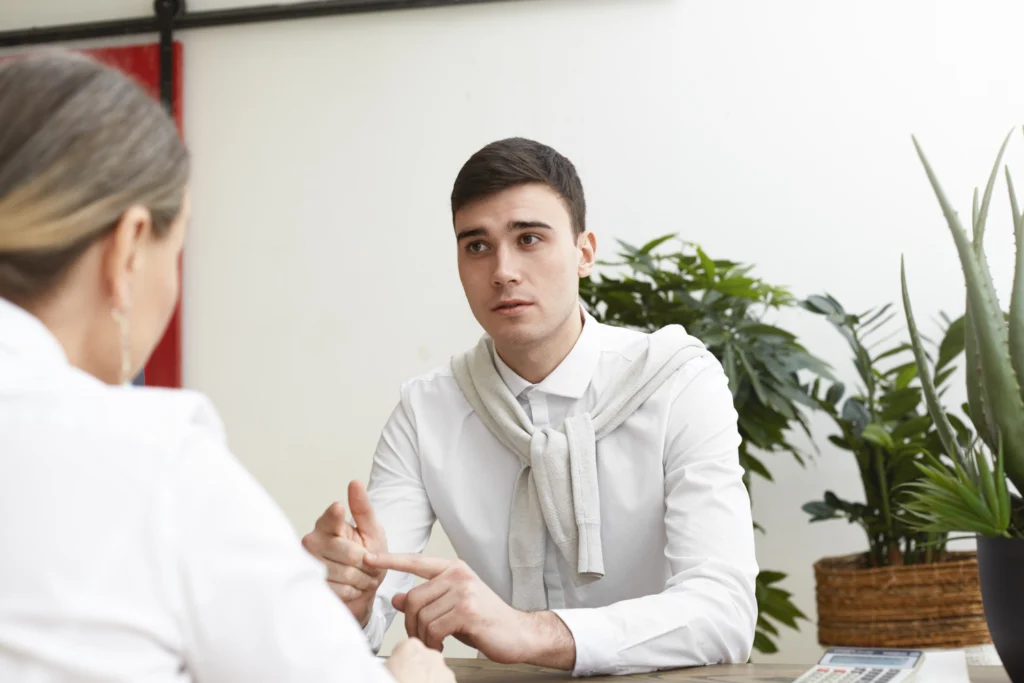 Man speaking with clinician during a forensic evaluation consultation