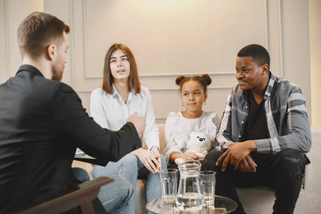 Family counseling session at home with therapist