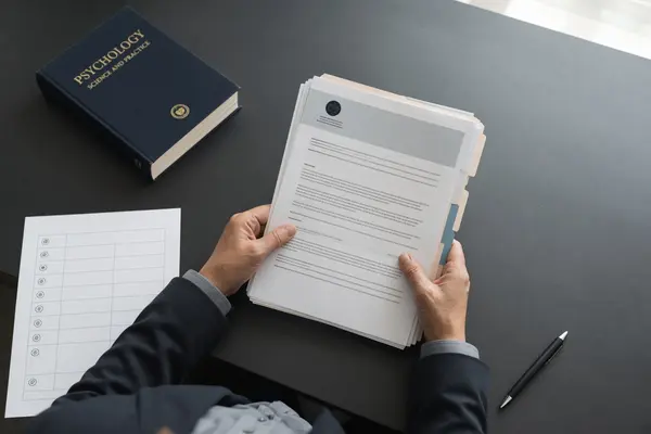 Photorealistic image of a rehabilitation professional reviewing medical and statute documents highlighting the cognitive assessment gap